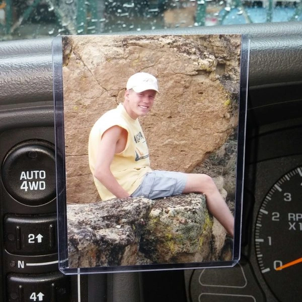 Photo of a man sitting on rocks
